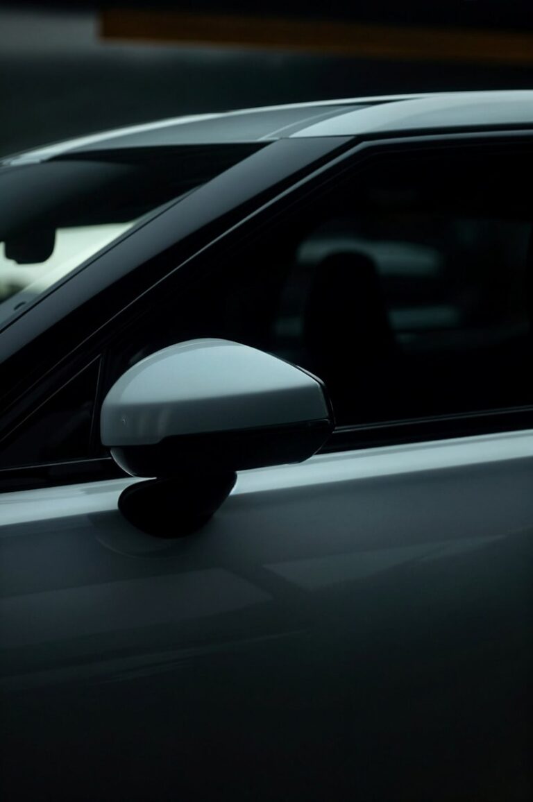 A close up of a car's side view mirror
